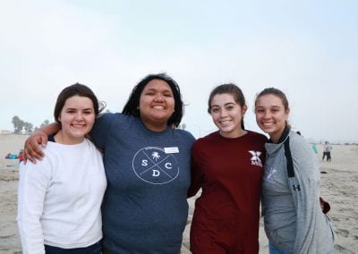 San Diego Christian College students pose on the sandy shore