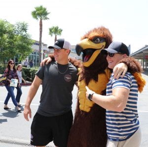 San Diego Christian College students pose with Hawks mascot