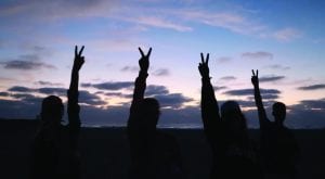 San Diego Christian College Students giving the peace sign