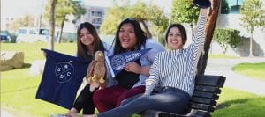 San Diego Christian College students wave school pennant with pride
