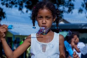 Global Missions child blowing bubbles